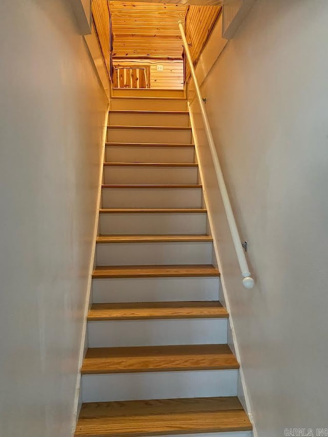 stairway featuring wood ceiling