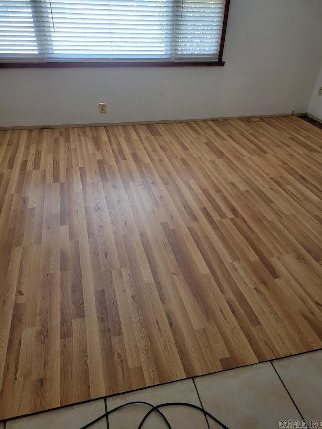 unfurnished room featuring light hardwood / wood-style floors