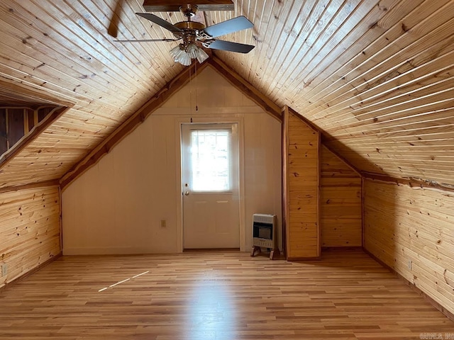 bonus room with wood ceiling, wood walls, vaulted ceiling, and light hardwood / wood-style flooring