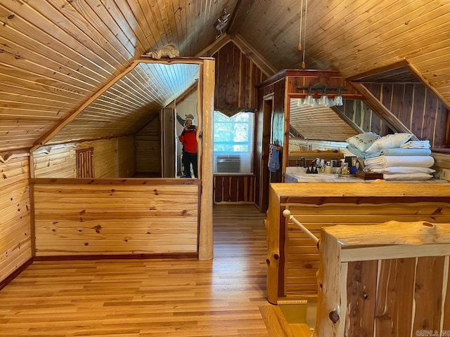 bonus room featuring wood ceiling, hardwood / wood-style flooring, and lofted ceiling