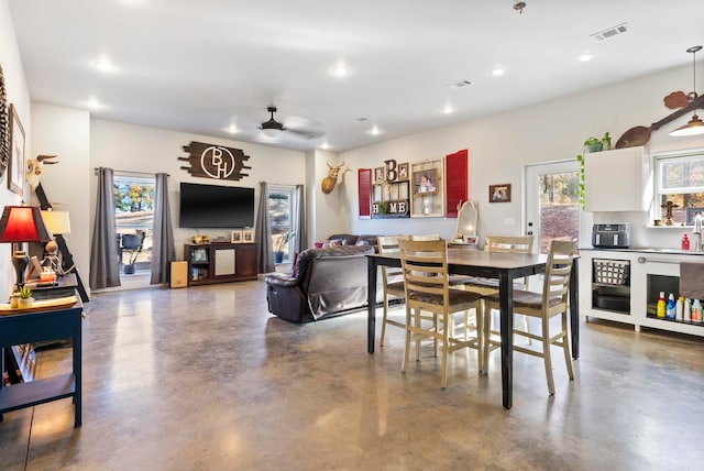 dining space featuring ceiling fan