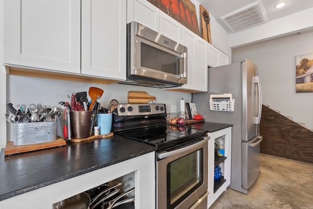 kitchen with appliances with stainless steel finishes and white cabinetry