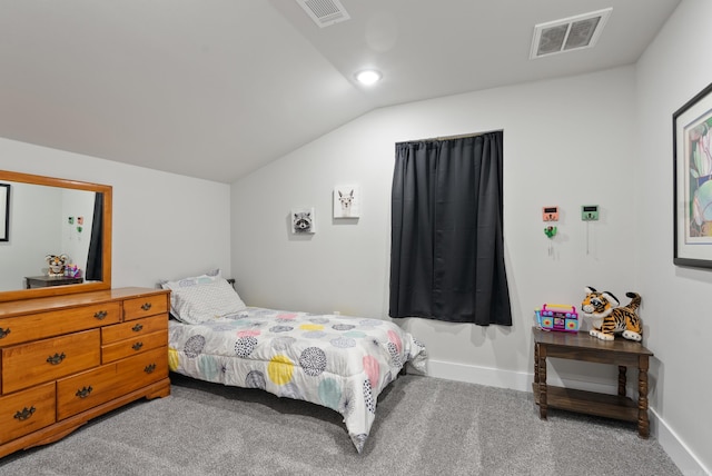 bedroom featuring carpet and vaulted ceiling