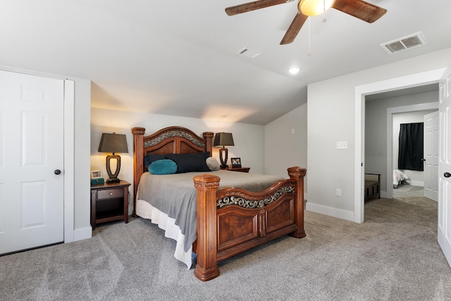 bedroom featuring lofted ceiling, light colored carpet, and ceiling fan