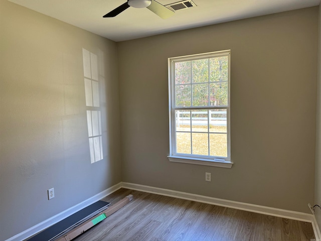 unfurnished room featuring light wood-type flooring and ceiling fan