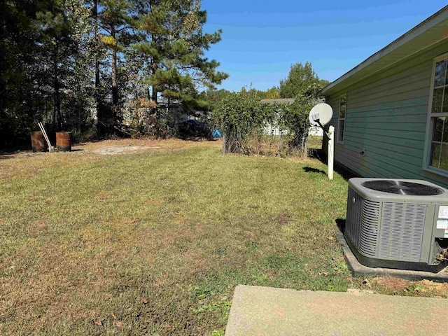 view of yard with central AC unit