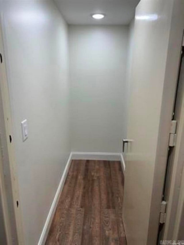 hall with dark hardwood / wood-style flooring