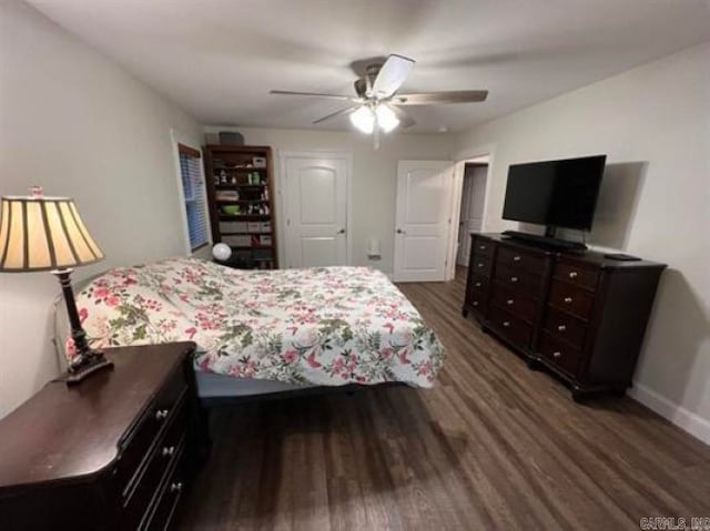 bedroom featuring dark hardwood / wood-style flooring and ceiling fan