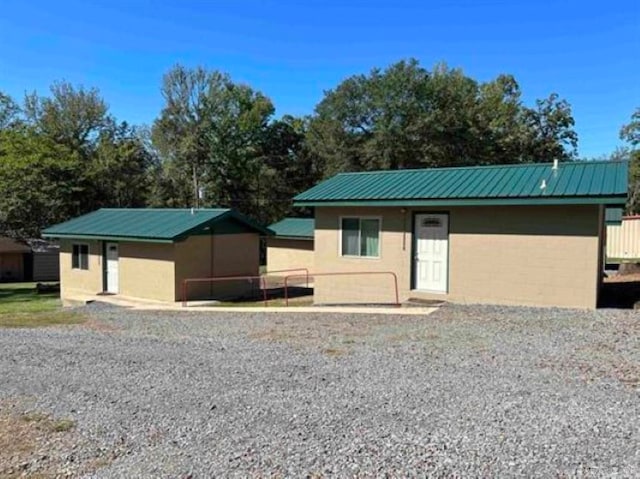 single story home with a storage unit