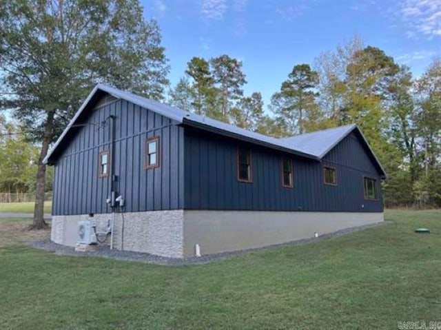 view of property exterior with a lawn