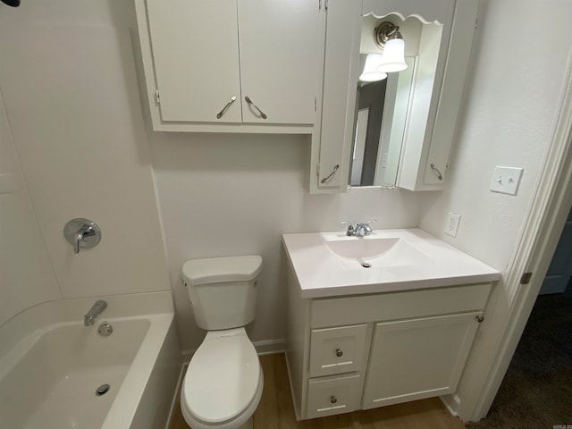 bathroom with vanity, hardwood / wood-style floors, and toilet