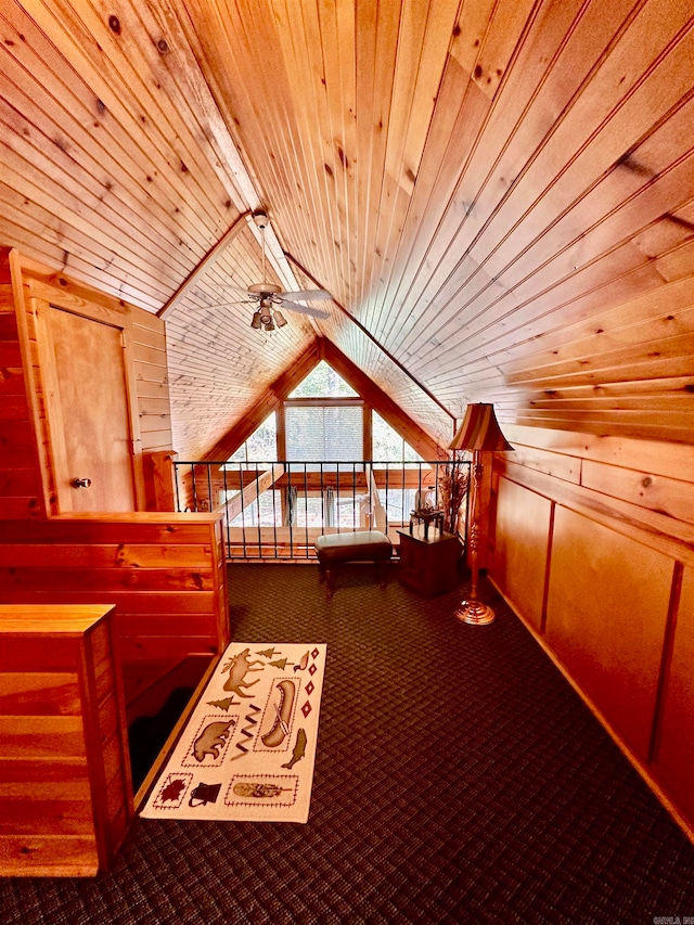 additional living space featuring wood ceiling, ceiling fan, vaulted ceiling, wood walls, and carpet floors