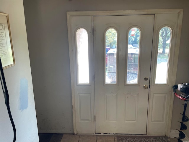 foyer featuring light tile patterned floors