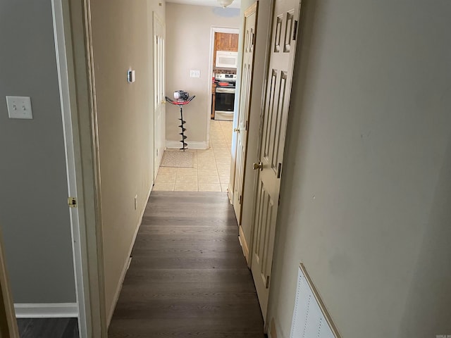 hallway featuring wood-type flooring