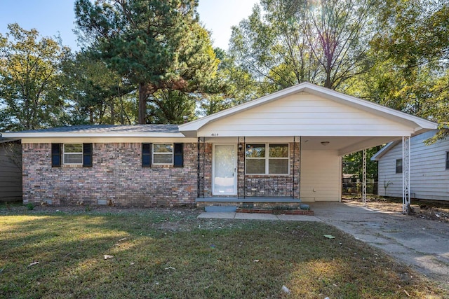 ranch-style home featuring a carport and a front yard