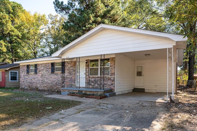 view of front of property with a carport and a porch