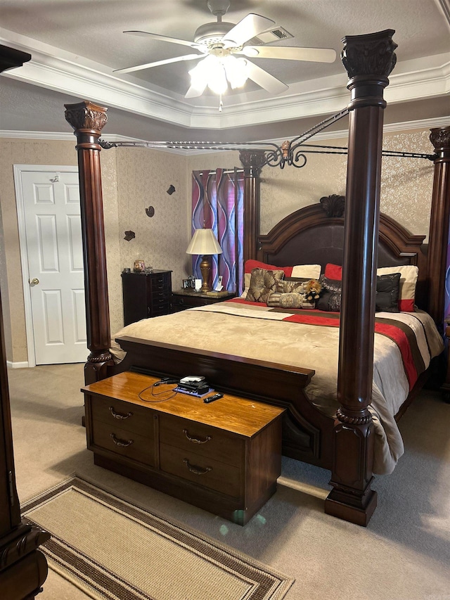 carpeted bedroom featuring ornamental molding and ceiling fan