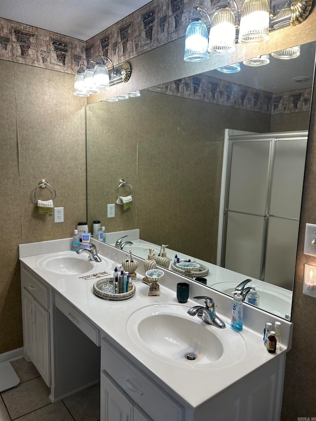 bathroom featuring vanity, an enclosed shower, and tile patterned flooring