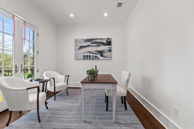 office featuring french doors, ornamental molding, and hardwood / wood-style floors