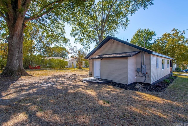 view of home's exterior featuring an outbuilding