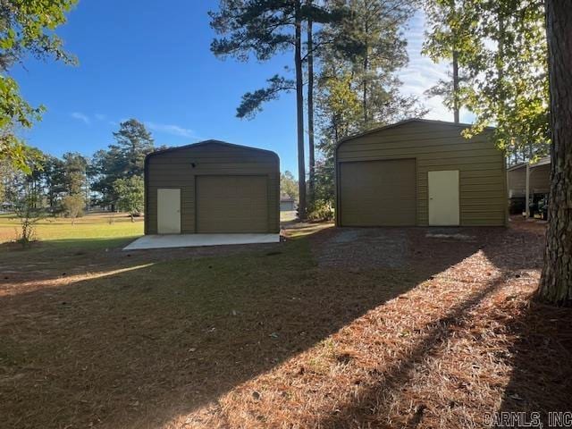 garage with a lawn