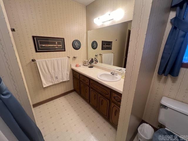 bathroom with vanity and toilet