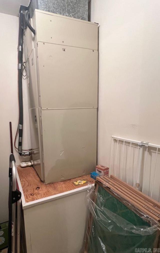 utility room with heating unit