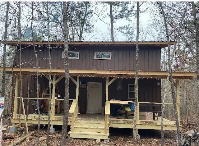 rear view of house featuring a deck