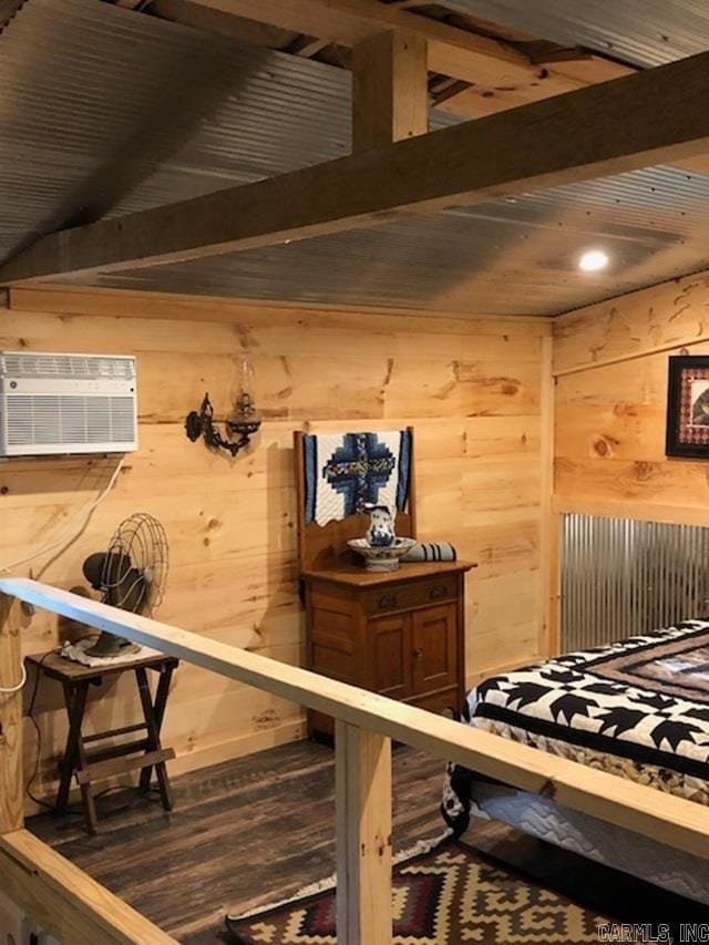 interior space featuring wood walls, beam ceiling, an AC wall unit, and dark hardwood / wood-style flooring