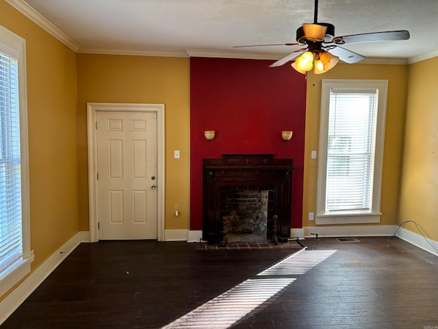 unfurnished living room with dark hardwood / wood-style floors, a healthy amount of sunlight, and ceiling fan