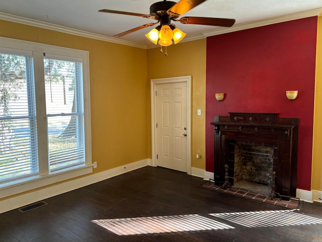 unfurnished living room featuring dark hardwood / wood-style flooring, ornamental molding, ceiling fan, and plenty of natural light