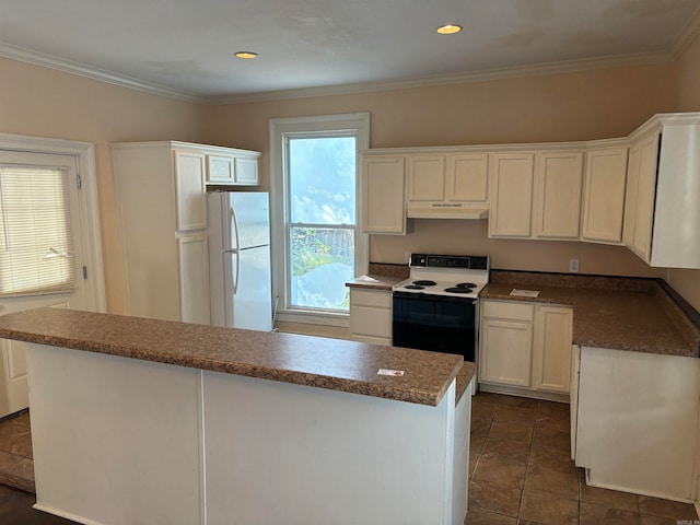 kitchen featuring dark tile patterned floors, a kitchen island, ornamental molding, white cabinetry, and white appliances