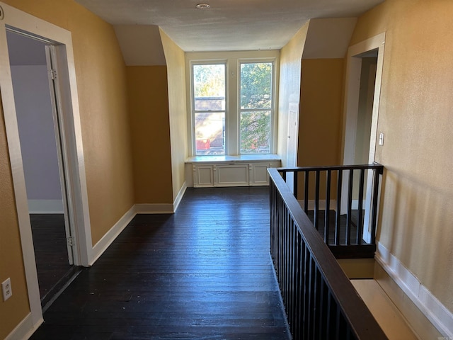 corridor featuring dark hardwood / wood-style flooring