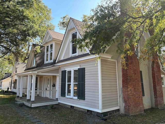 view of home's exterior with covered porch