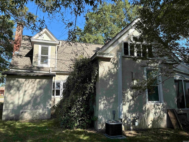 view of side of property featuring cooling unit