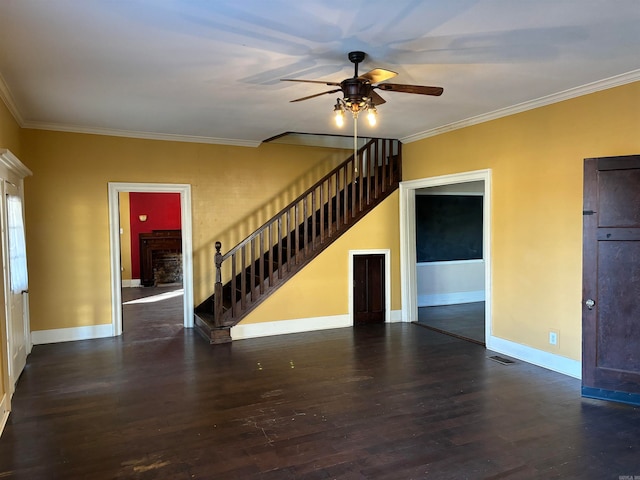 unfurnished room with dark wood-type flooring, ceiling fan, and ornamental molding