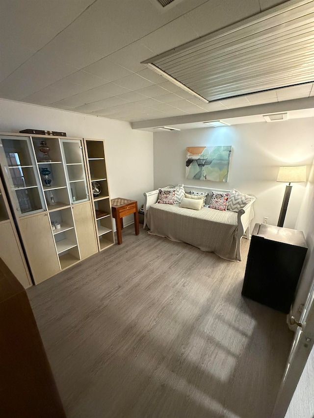 bedroom with wood-type flooring