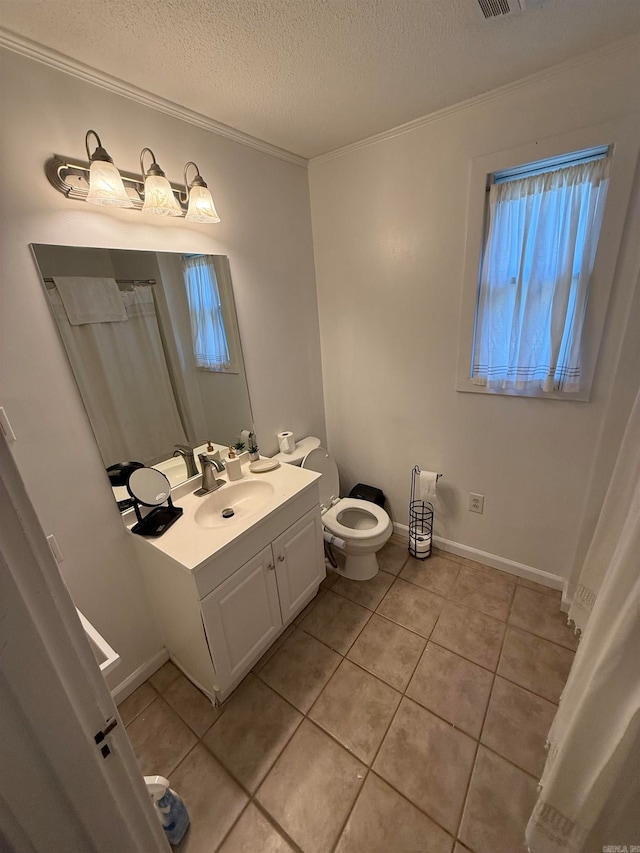 bathroom with a textured ceiling, toilet, vanity, ornamental molding, and tile patterned flooring