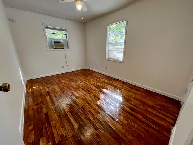 unfurnished room featuring hardwood / wood-style floors, cooling unit, and ceiling fan