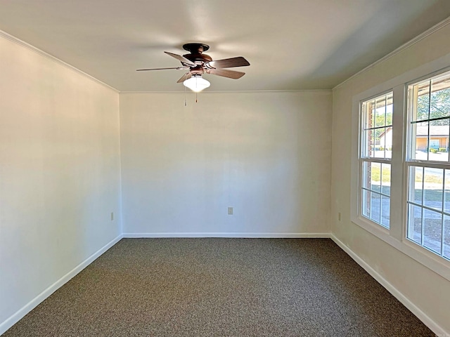 spare room with crown molding, carpet floors, and ceiling fan