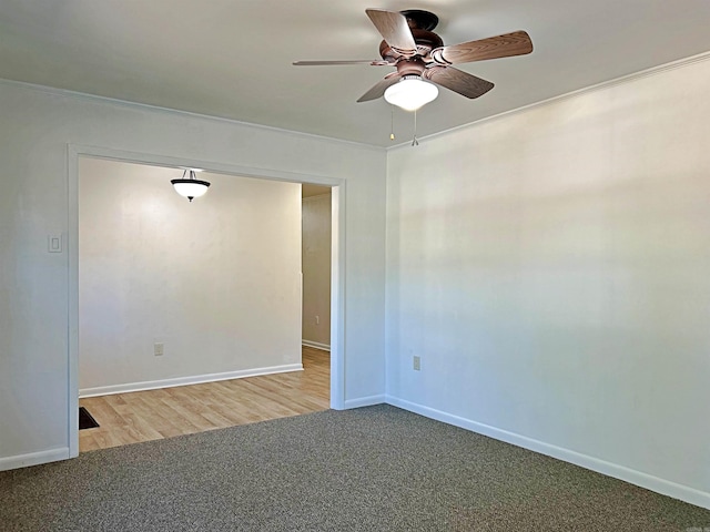 spare room with light hardwood / wood-style flooring, crown molding, and ceiling fan