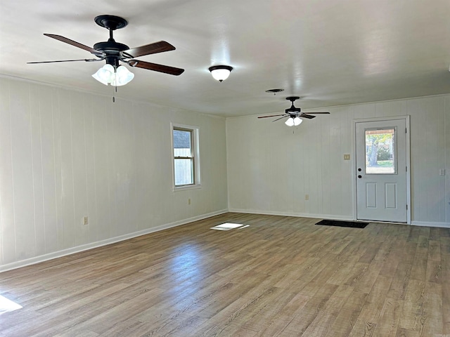 interior space with light wood-type flooring and ceiling fan