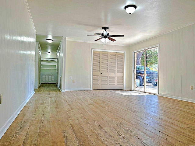 interior space with ornamental molding, light hardwood / wood-style flooring, and ceiling fan