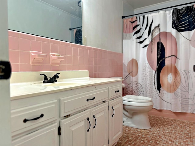 full bathroom featuring shower / tub combo, tile walls, toilet, vanity, and tile patterned floors