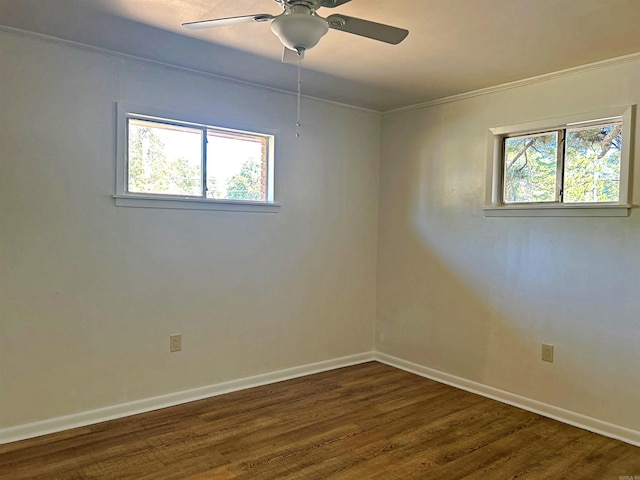 spare room with ceiling fan, crown molding, and dark hardwood / wood-style flooring