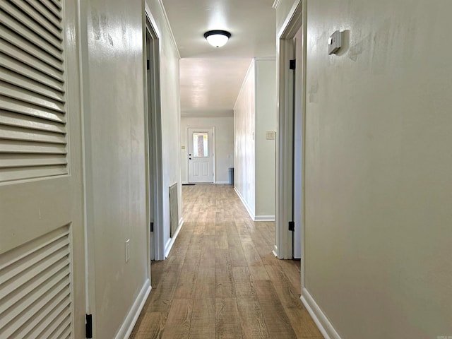 corridor with light wood-type flooring