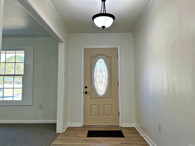 entryway featuring hardwood / wood-style flooring and ornamental molding