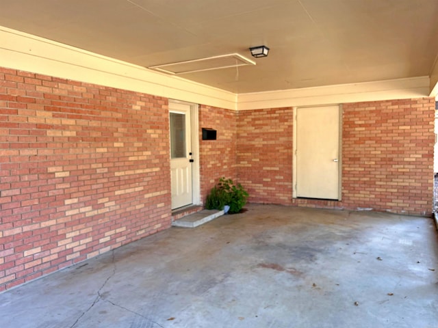 entrance to property featuring a patio area