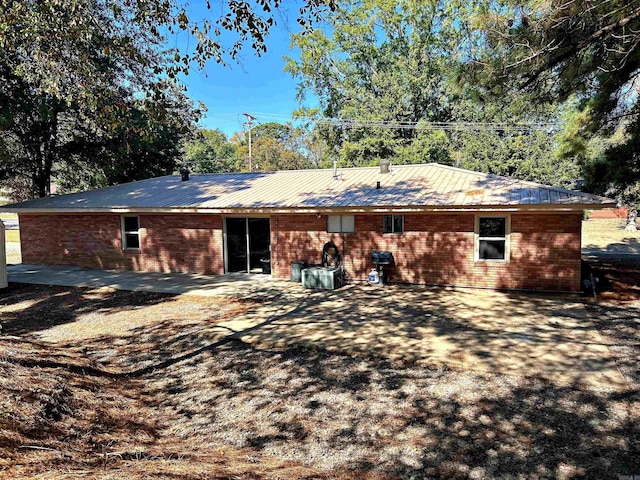 rear view of house featuring a patio area