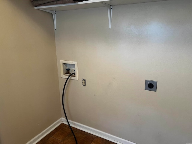 laundry room with dark tile patterned floors, hookup for a washing machine, and electric dryer hookup